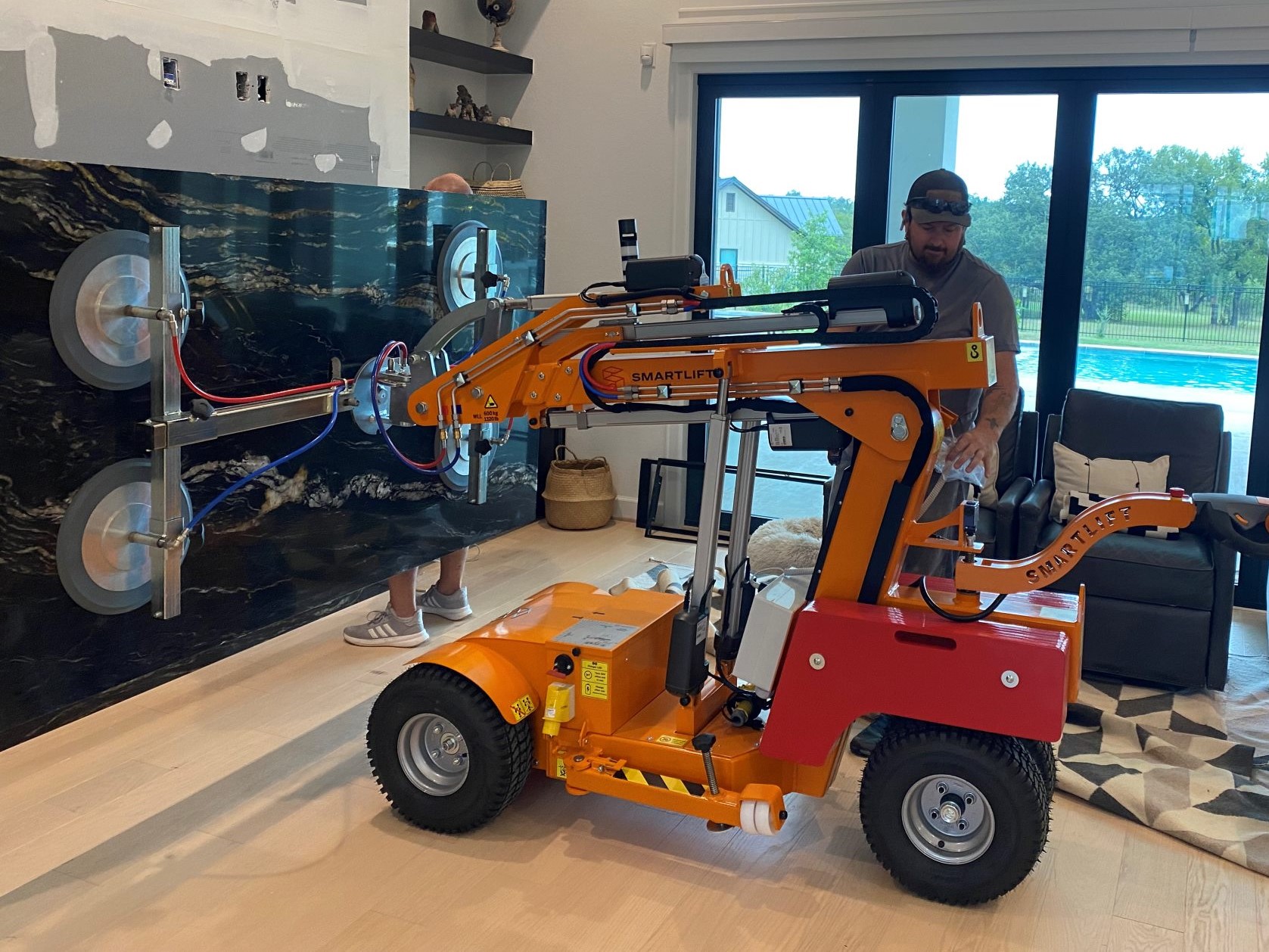 Smartlift SL 609 HLE lifting a granite slab at a stone fabrication job