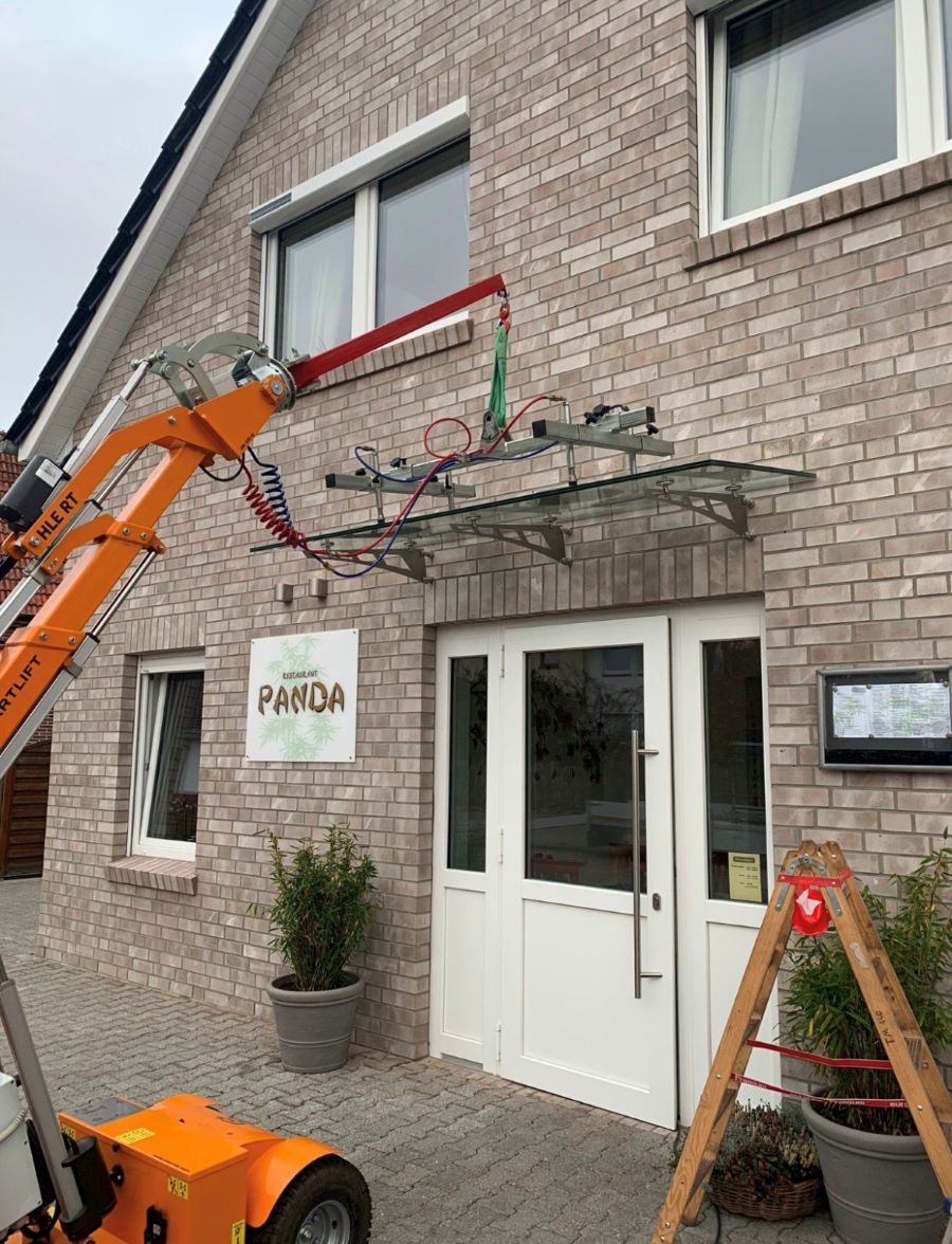 Smartlift SL 609 installing a tall window at height on a residential job