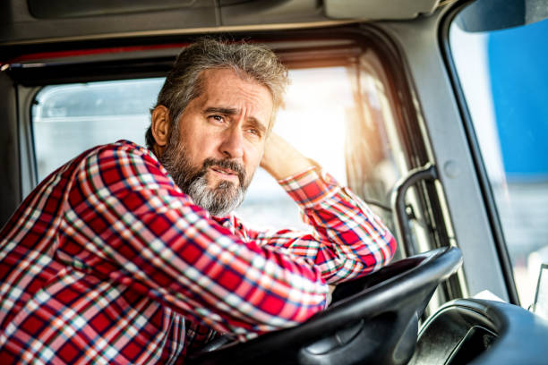 Driver waiting on a logistic platform for his truck to be unloaded