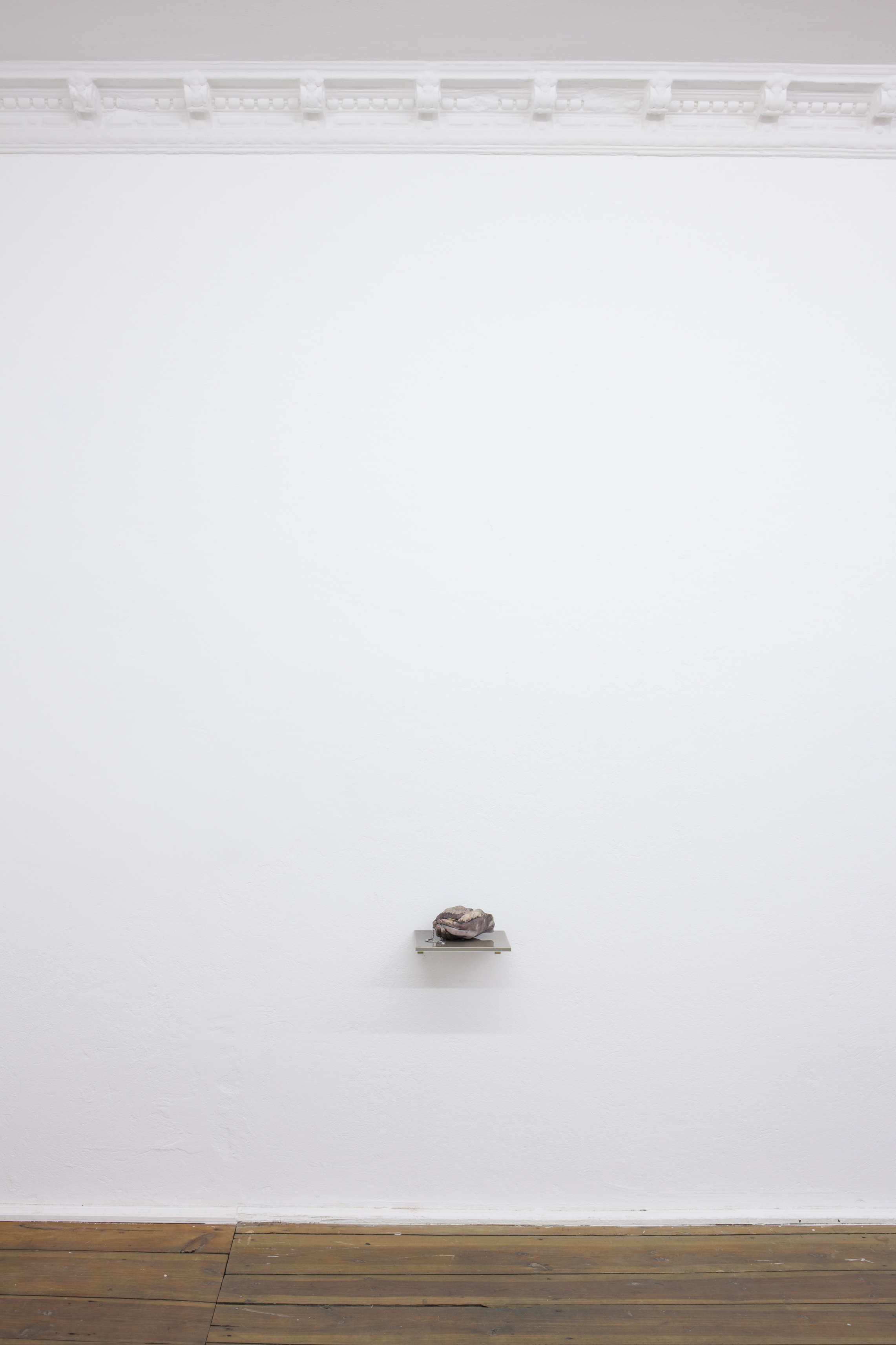 Mia Goyette, Drain #3 (pink), 2016. Cast plaster, pigment, chained drain valve, various debris, epoxy resin. Unique