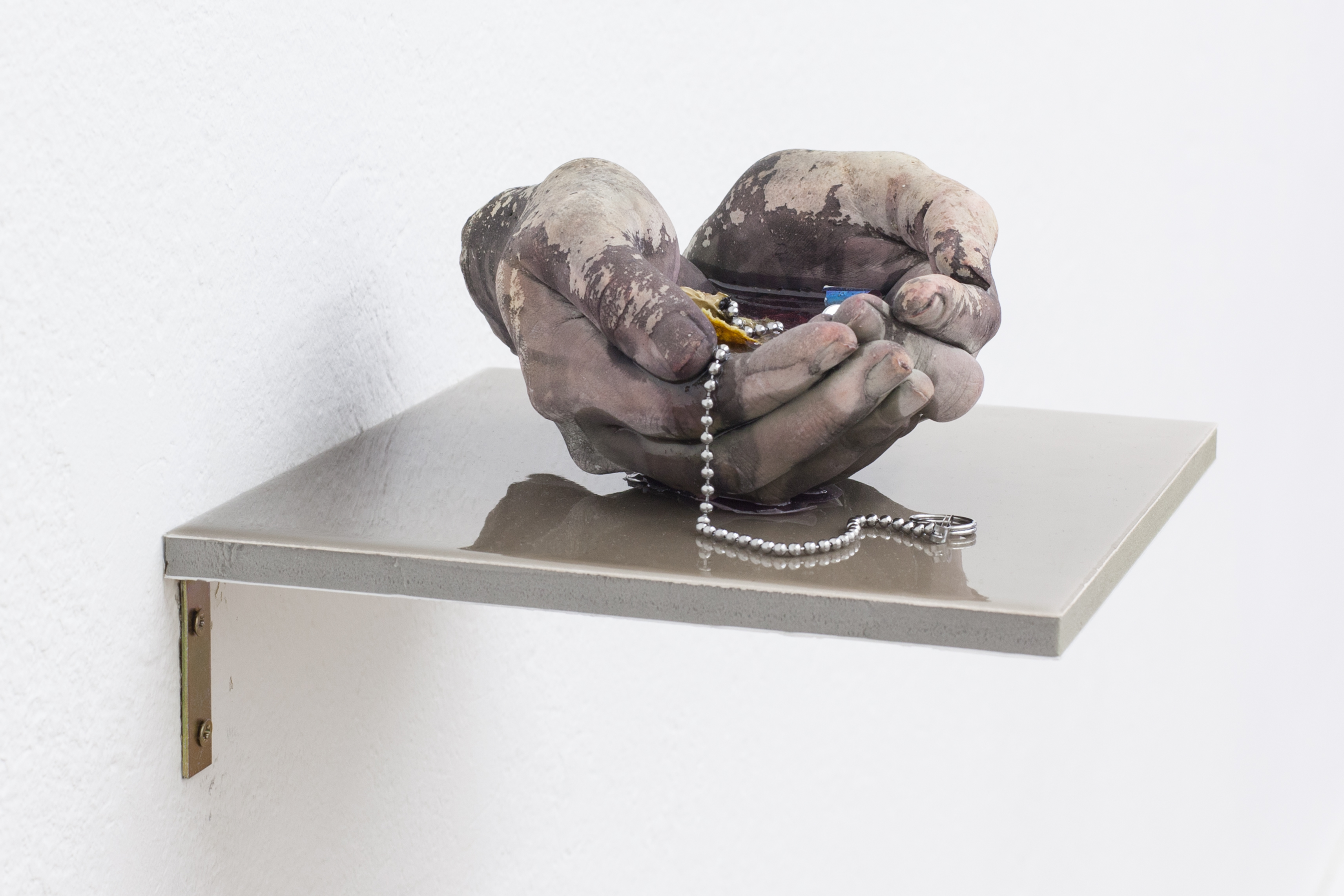 Mia Goyette, Drain #3 (pink), 2016. Cast plaster, pigment, chained drain valve, various debris, epoxy resin. Unique