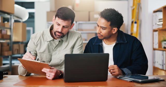 two_people_looking_at_checklist