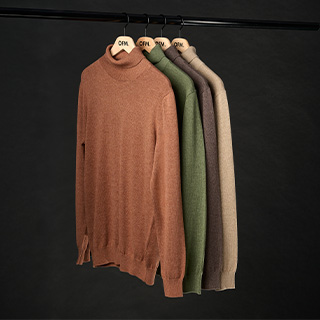 Afbeelding van truien aan hanger