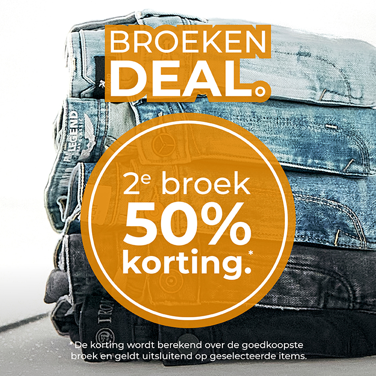 Stack of jeans with a promotional text overlay: "BROEKEN DEAL. 2e broek 50% korting." Several pairs of folded jeans are visible.