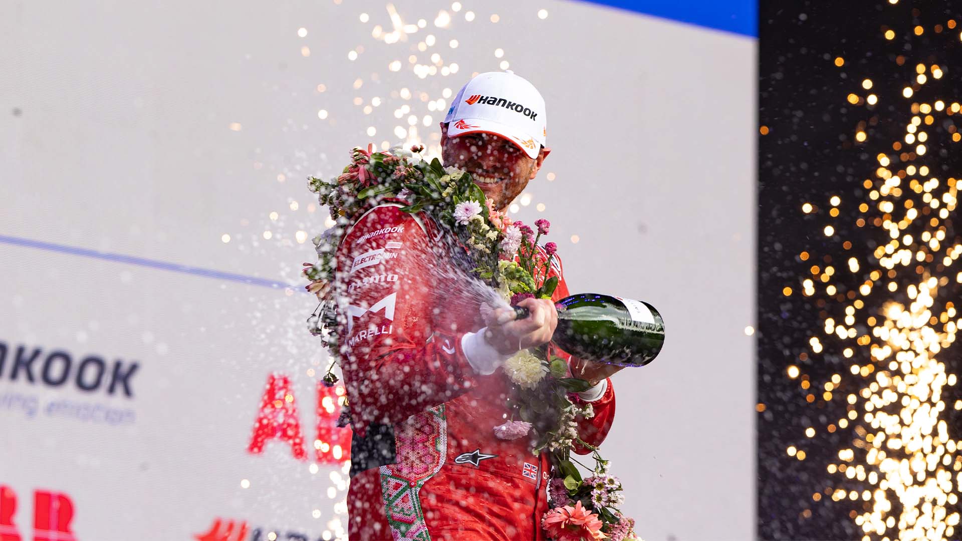 Oliver Rowland sprays champagne on the Mexico City podium