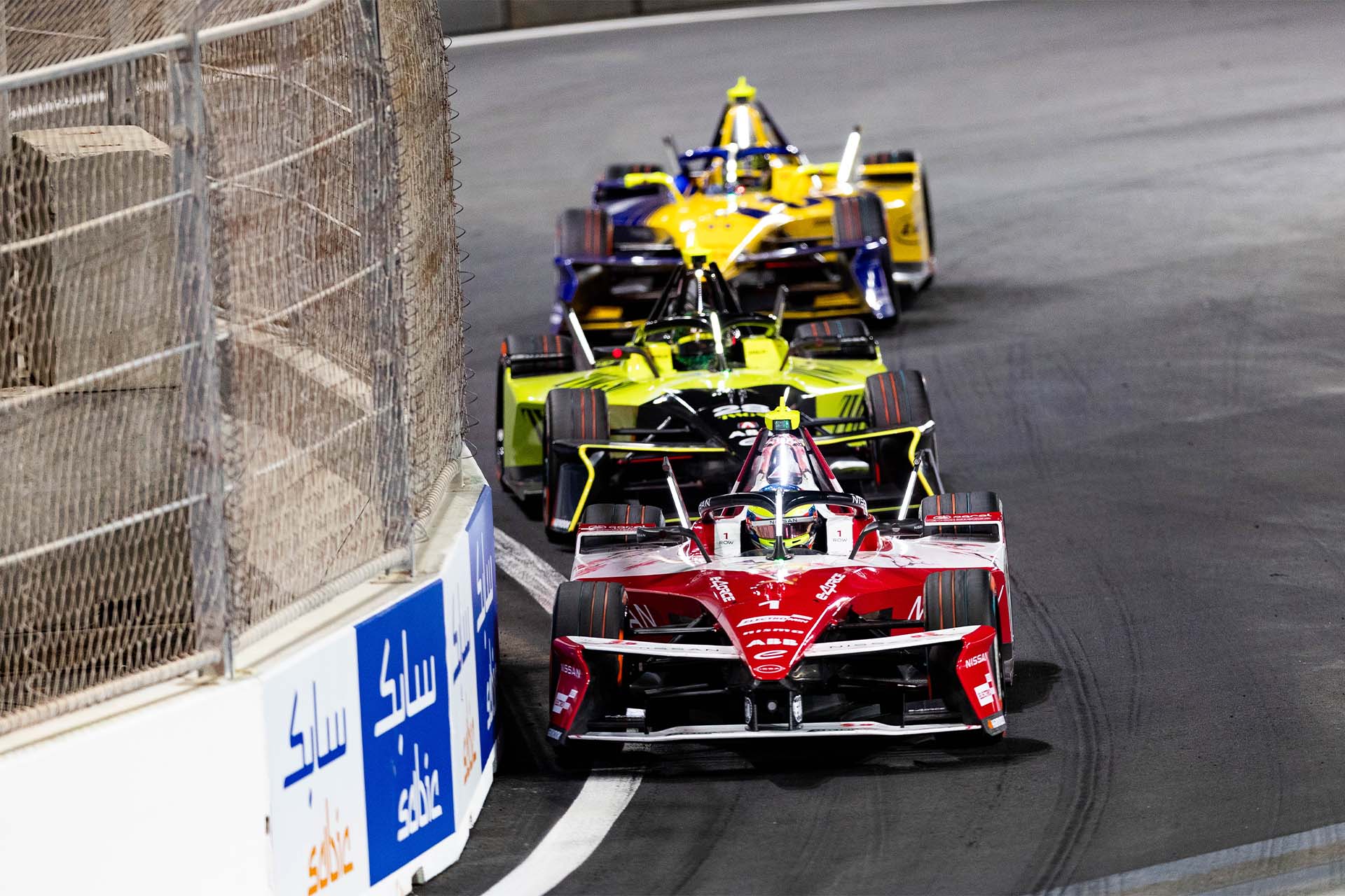 Oliver Rowland leads a group of cars in Jeddah