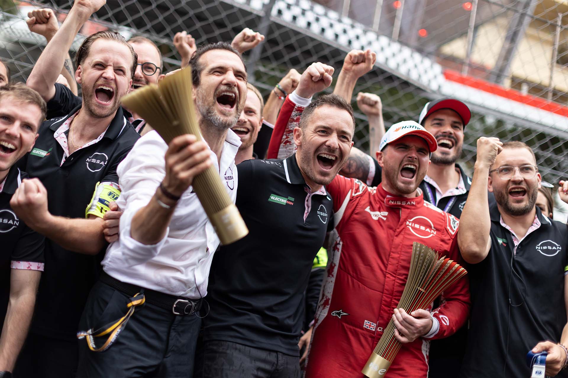 Oliver Rowland celebrates Monaco win with team members, including Tommaso Volpe and Dorian Boisdron