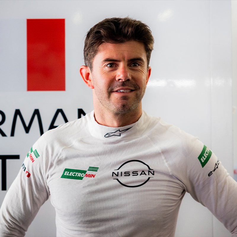 Norman Nato smiles in the Nissan Formula E garage