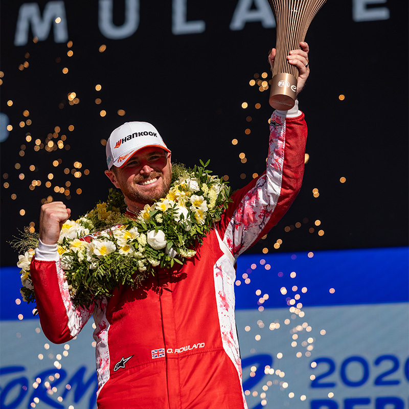 Oliver Rowland celebrating on the Berlin podium