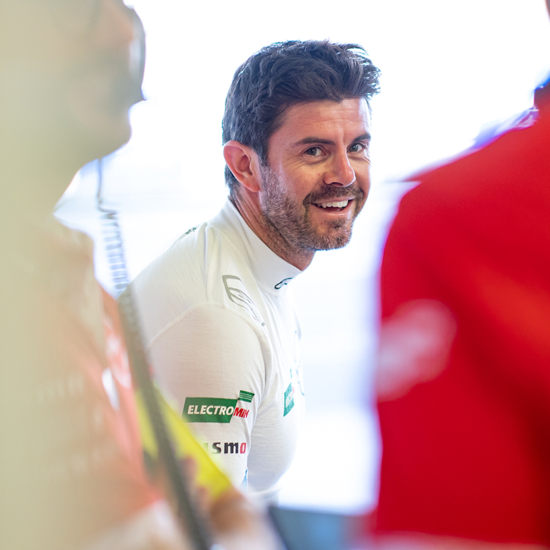 Norman Nato smiling in the Nissan Formula E Team garage