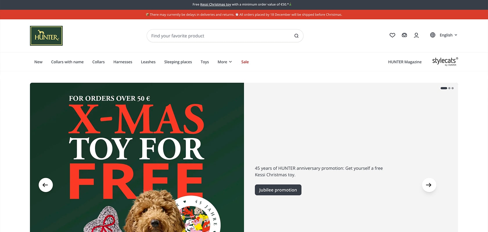 HUNTER website homepage showing a green X‑mas promo with a curly brown dog, "X-MAS SPIELZEUG GRATIS" banner and "45 Jahre HUNTER" anniversary text.