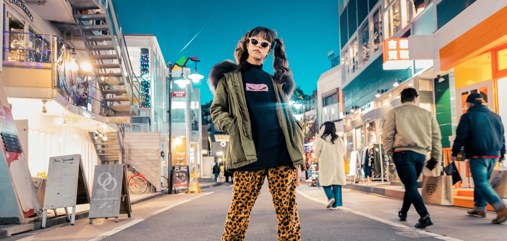 a woman stands on a street