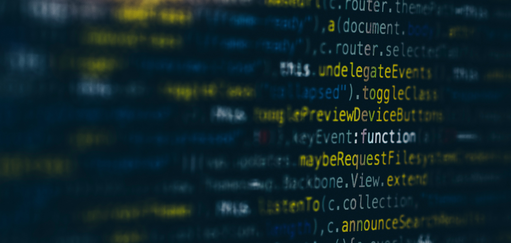 Eine verschwommene Ansicht von buntem Computercode, in der Wörter wie „toggleClass“ und „function“ auf einem Bildschirm hervorgehoben sind.