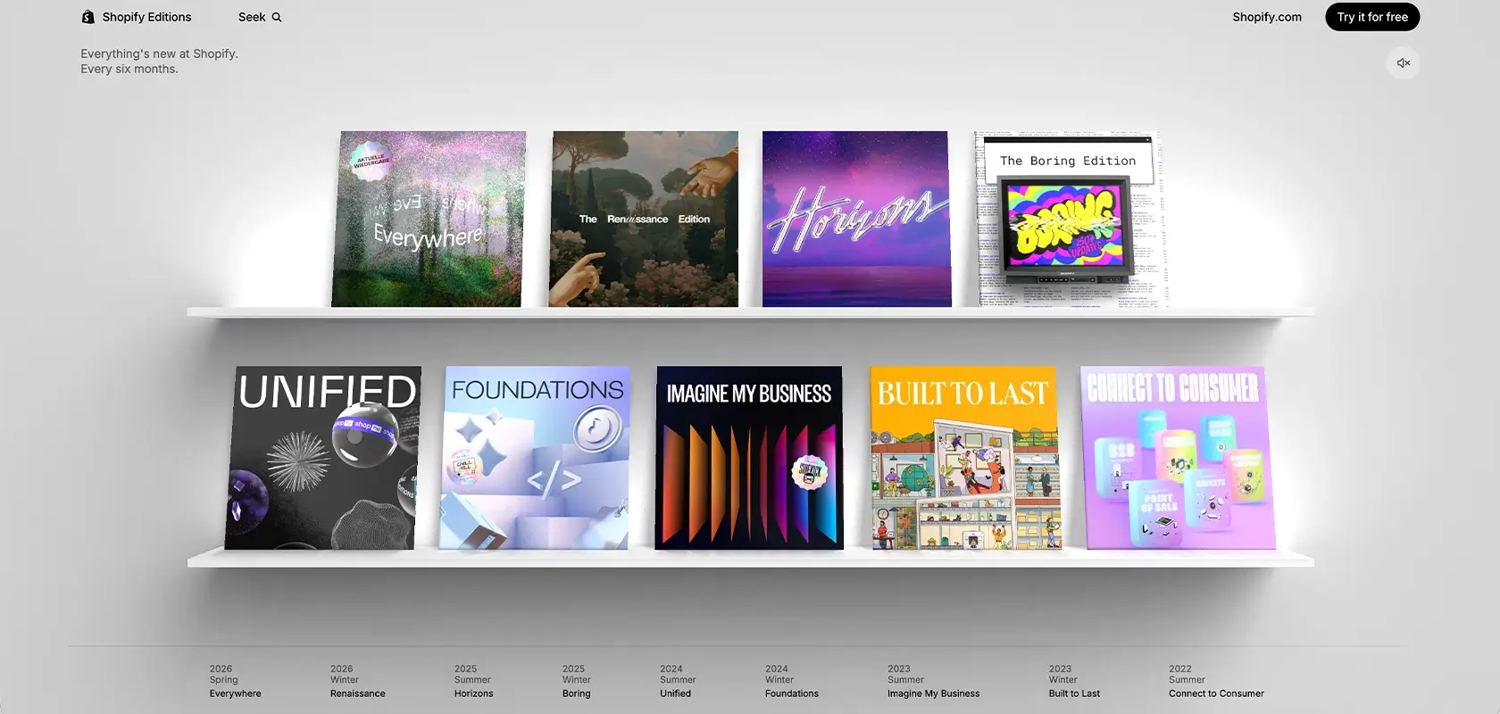 A wall shelf with various colorful album covers featuring different designs arranged in two rows.