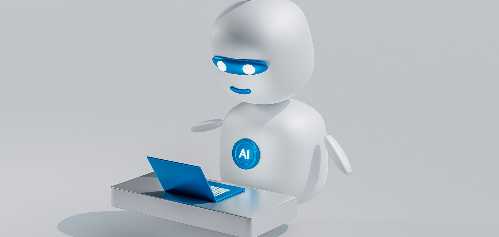 Ein 3D-Roboter mit einem blauen „AI“-Logo arbeitet an einem Laptop an einem kleinen Schreibtisch vor einem schlichten grauen Hintergrund.