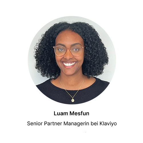 Smiling person with curly hair and glasses. Text below reads: “Luam Mesfun, Senior Partner Manager at Klaviyo.”