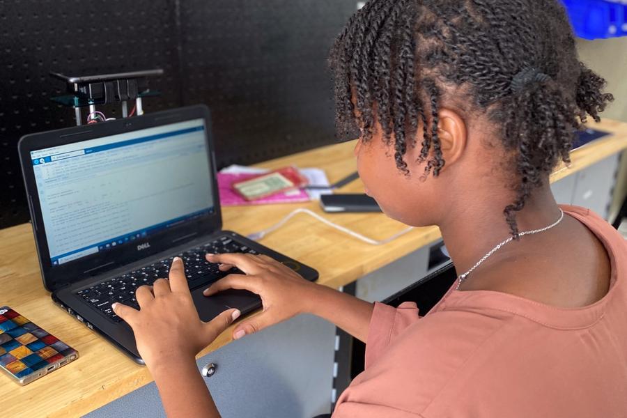 Young people working on robotics kits at the Hector Foundation's maker labs in Haiti.