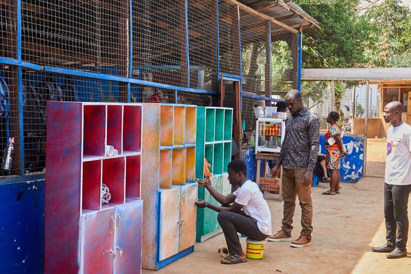 Children reading at a classroom library corner in Ghana