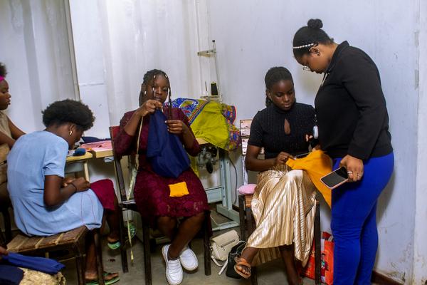 Women learning to sew at a workshop in Luanda