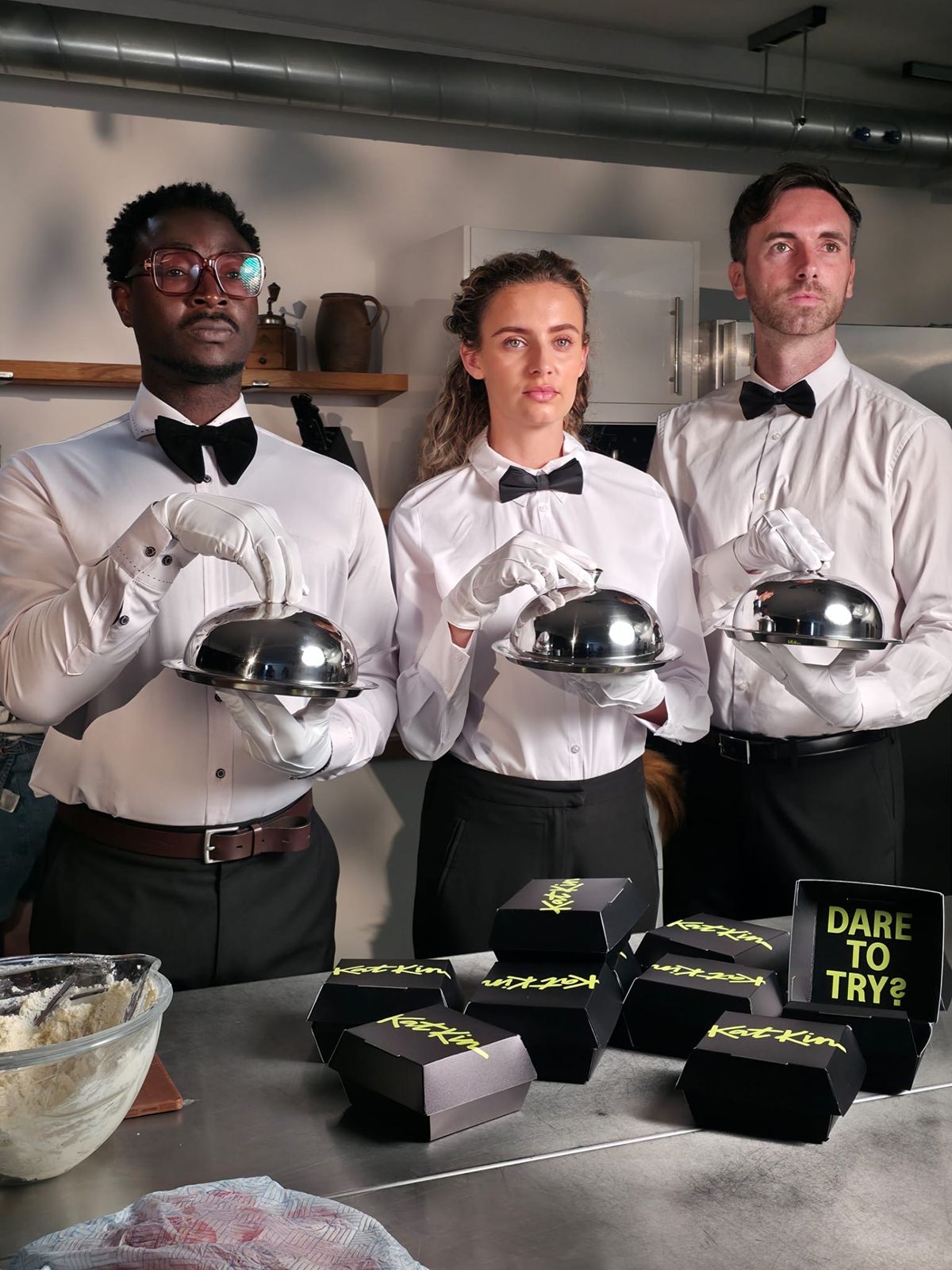 Waiters hold Cluck burger