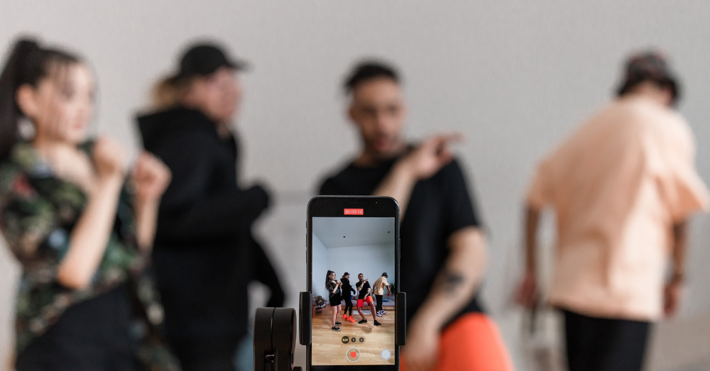 young people are recording their dance challenge for tiktok