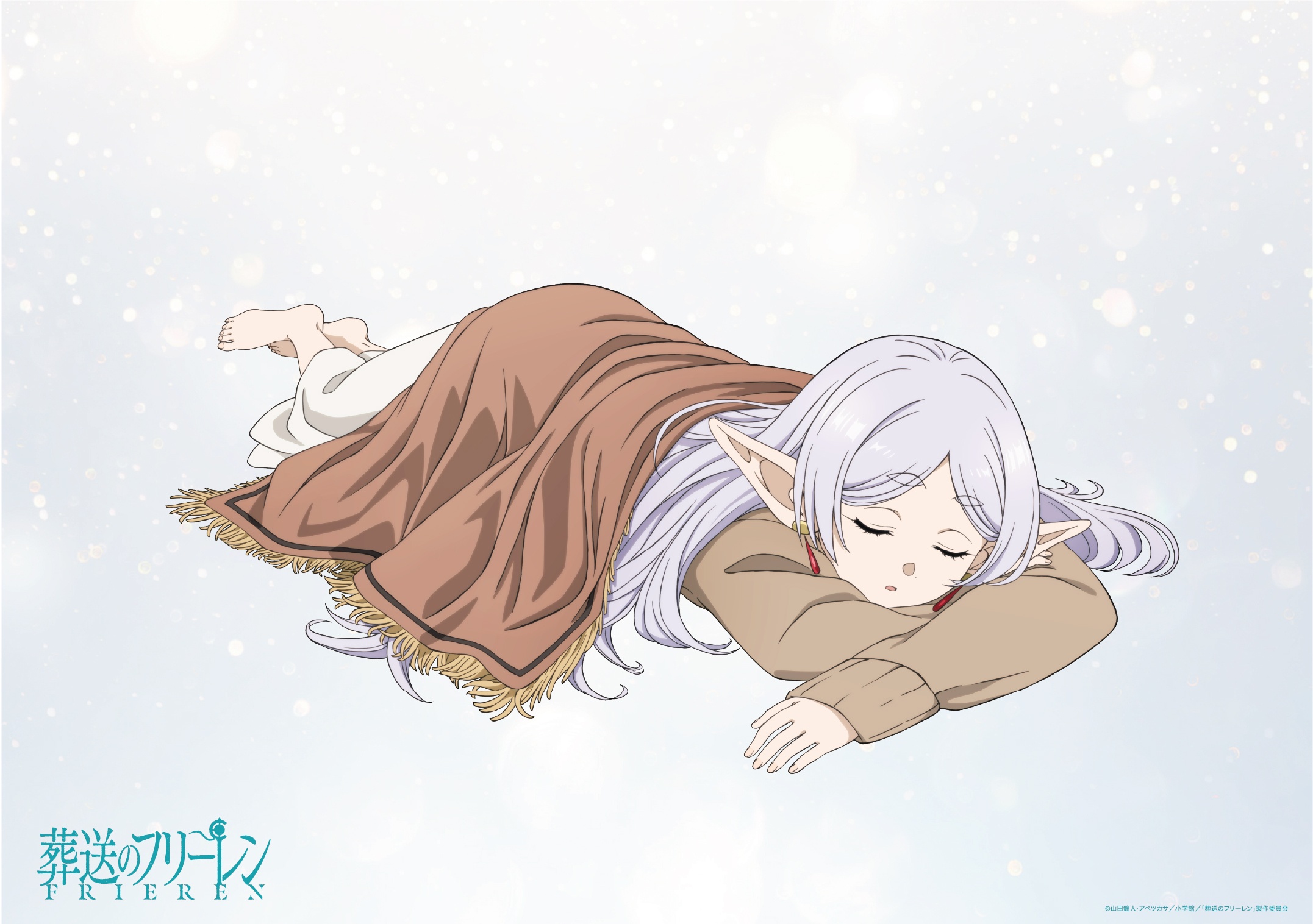 Character art of Frieren, an elven mage with long silver hair and pointed ears, napping beneath blanket for the upcoming second season of the Frieren: Beyond Journey's End TV anime. Frieren is using her arms as a pillow, and she's sleeping on her stomach.