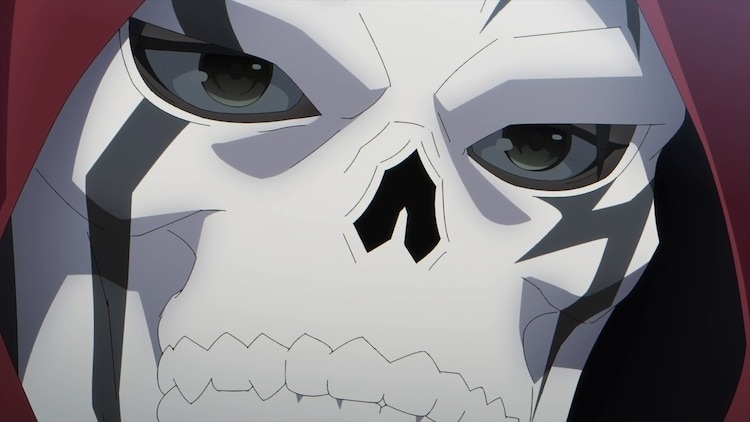 Ike, a human magician, wears a skull mask to disguise his true identity from his demon cohorts in a scene from the upcoming The Strongest Magician in the Demon Lord's Army was a Human TV anime.