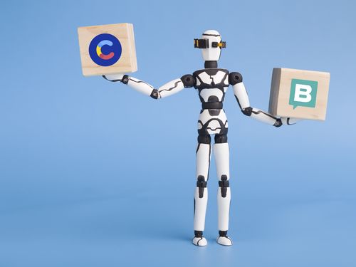 robot-holding-two-wooden-cubes-storyblok-contentful