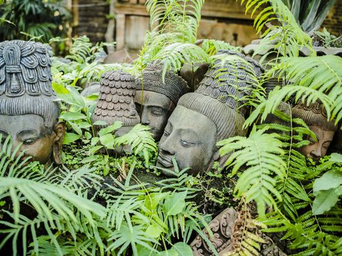 Terracotta head sculptures in garden