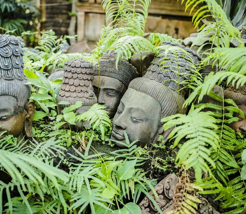 Terracotta head sculptures in garden