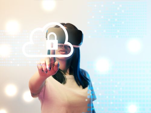 Young woman pointing at secure cloud icon