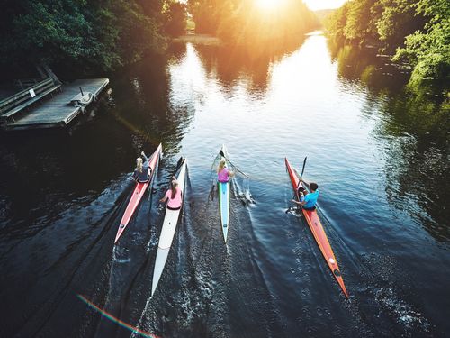 Team of people rowing