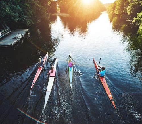Team of people rowing