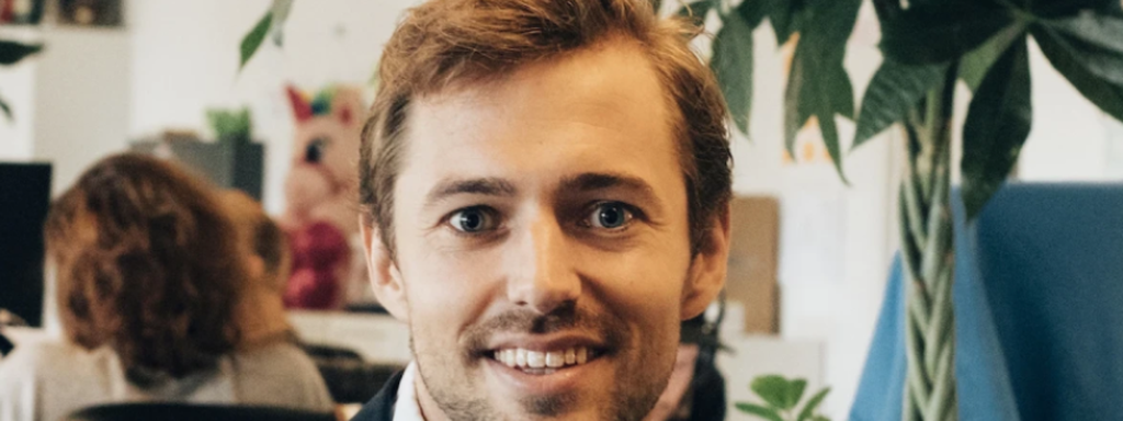 Headshot of Inex One CEO Max Friberg, with Peerspectrum and Inex One logos