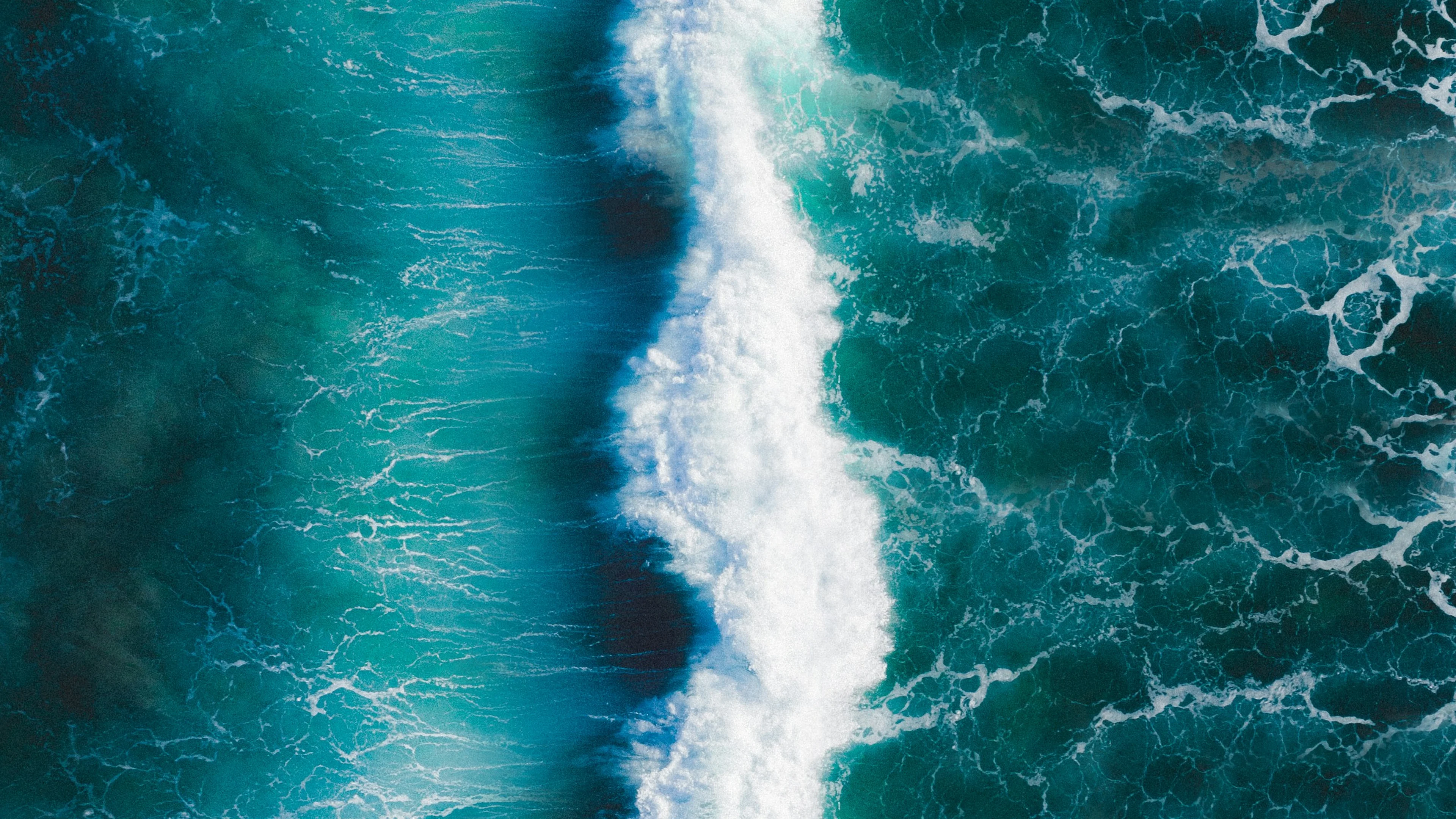 Waves crashing together arial view