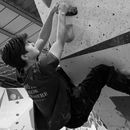 student rock climbing