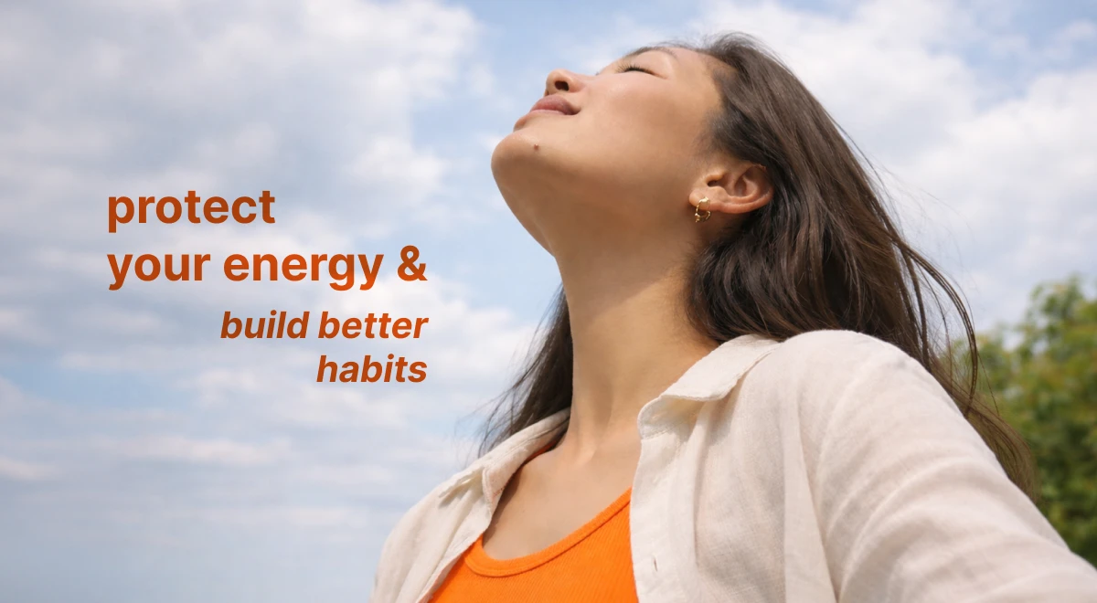 Young woman with closed eyes tilting her face toward a cloudy sky outdoors, embodying discipline and self-growth through a calm, mindful mindset