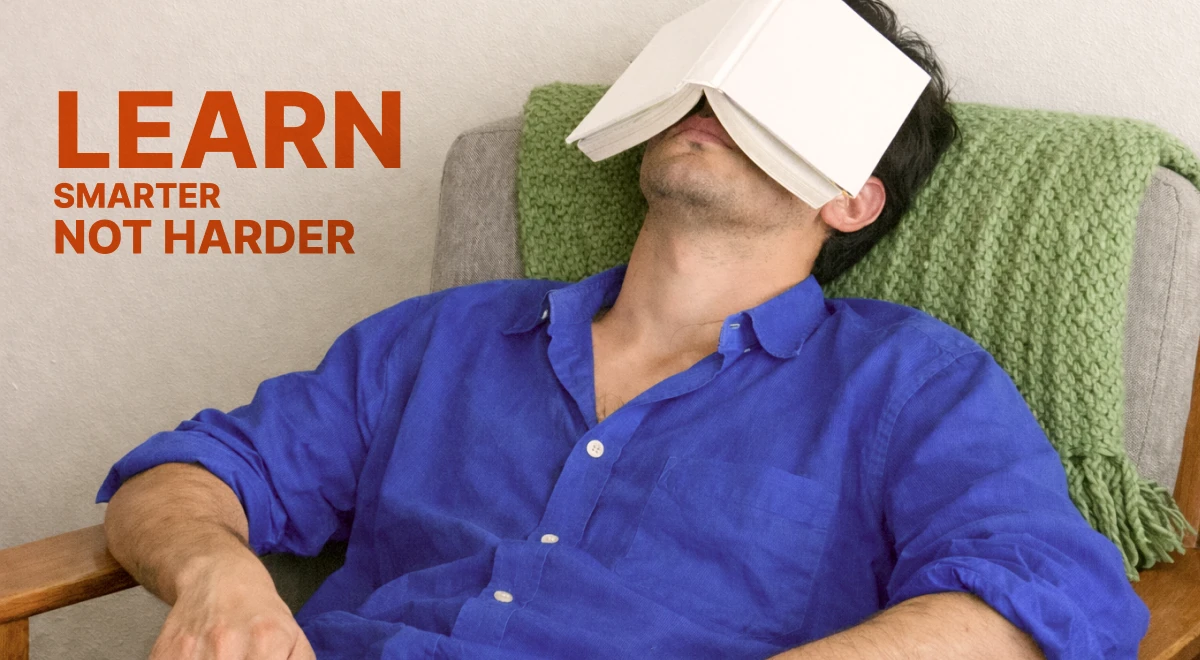 Man in blue shirt reclining on a couch with a book over his face,learning platform concept with orange _Learn Smarter Not Harder_ text