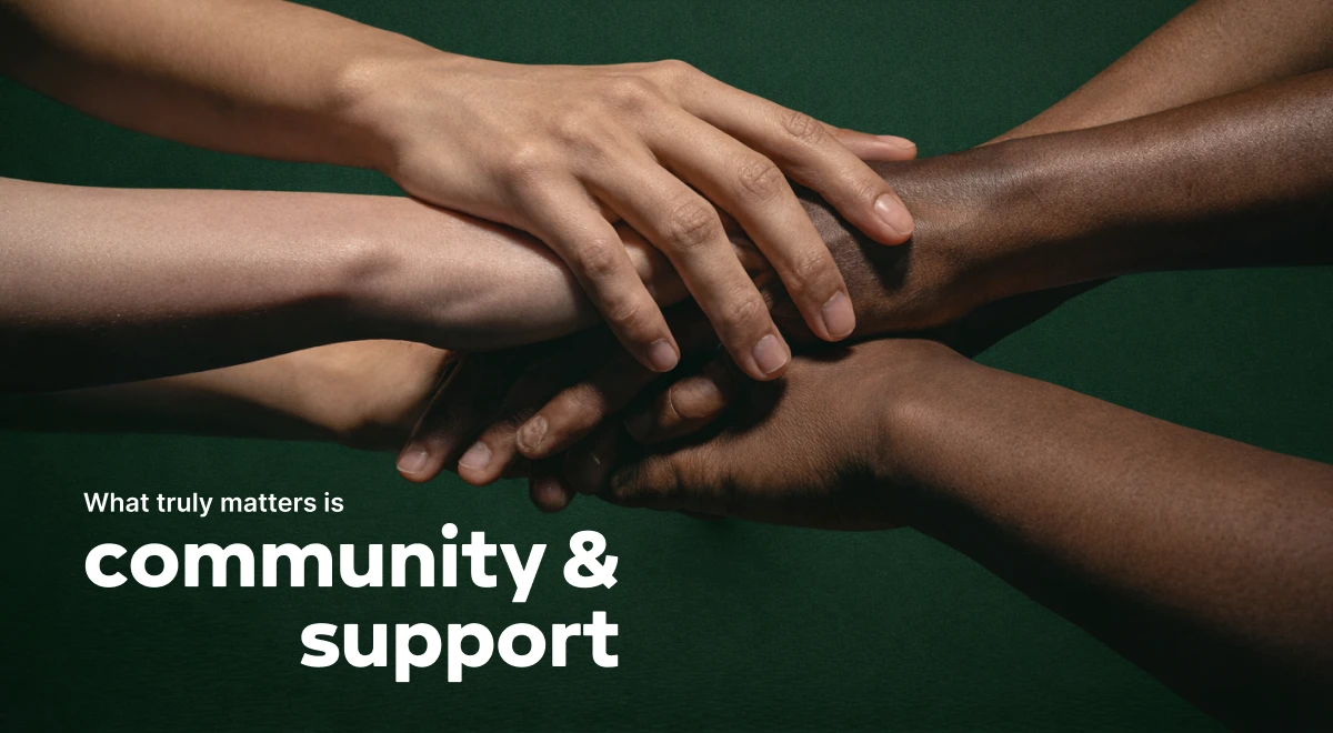 Diverse hands stacked together on a dark green background, symbolizing community and support — a core theme in the Girl in Pieces book review