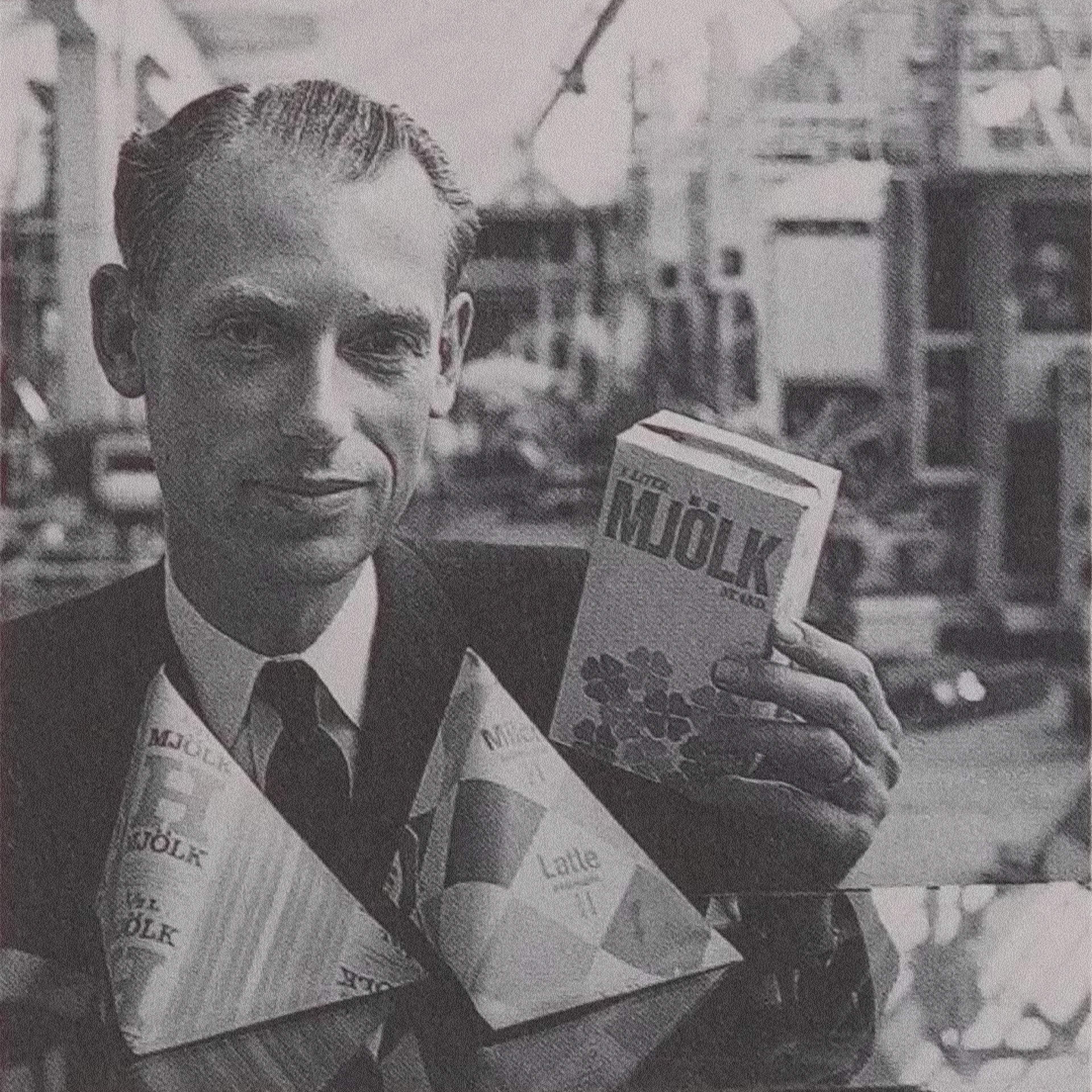 Hans Rausing with the two packages that built an empire