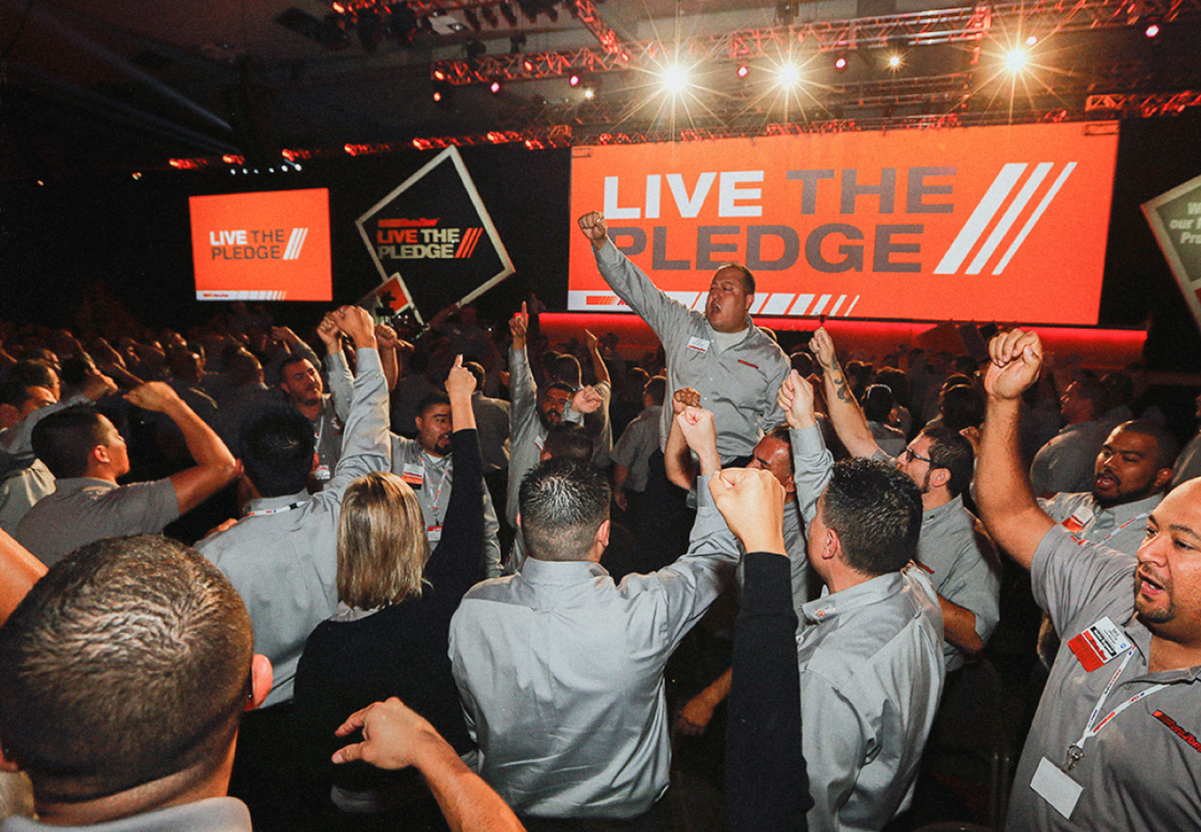 A gathering of AutoZoners, encouraging them to "Live The Pledge".