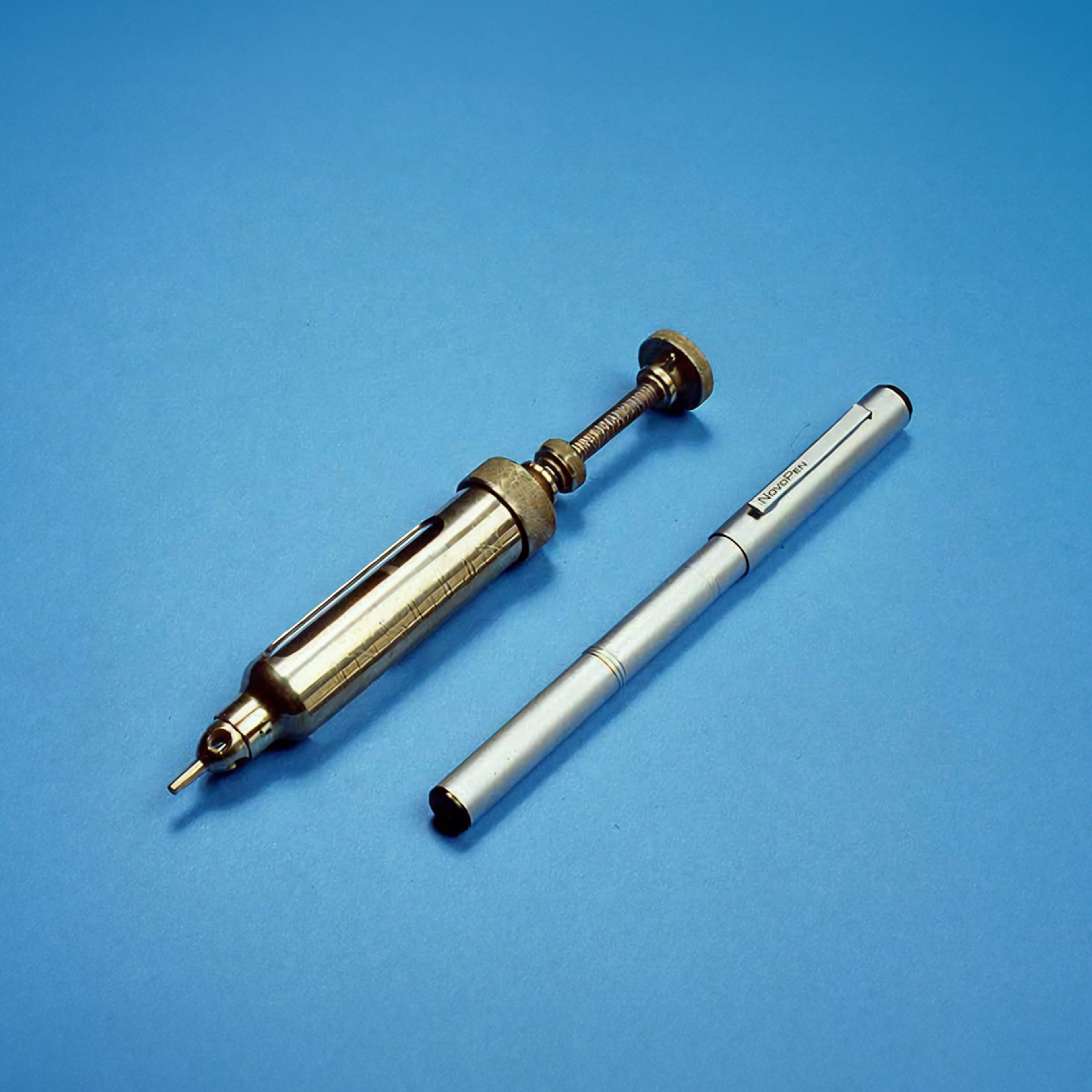 An insulin syringe and the NovoPen side by side