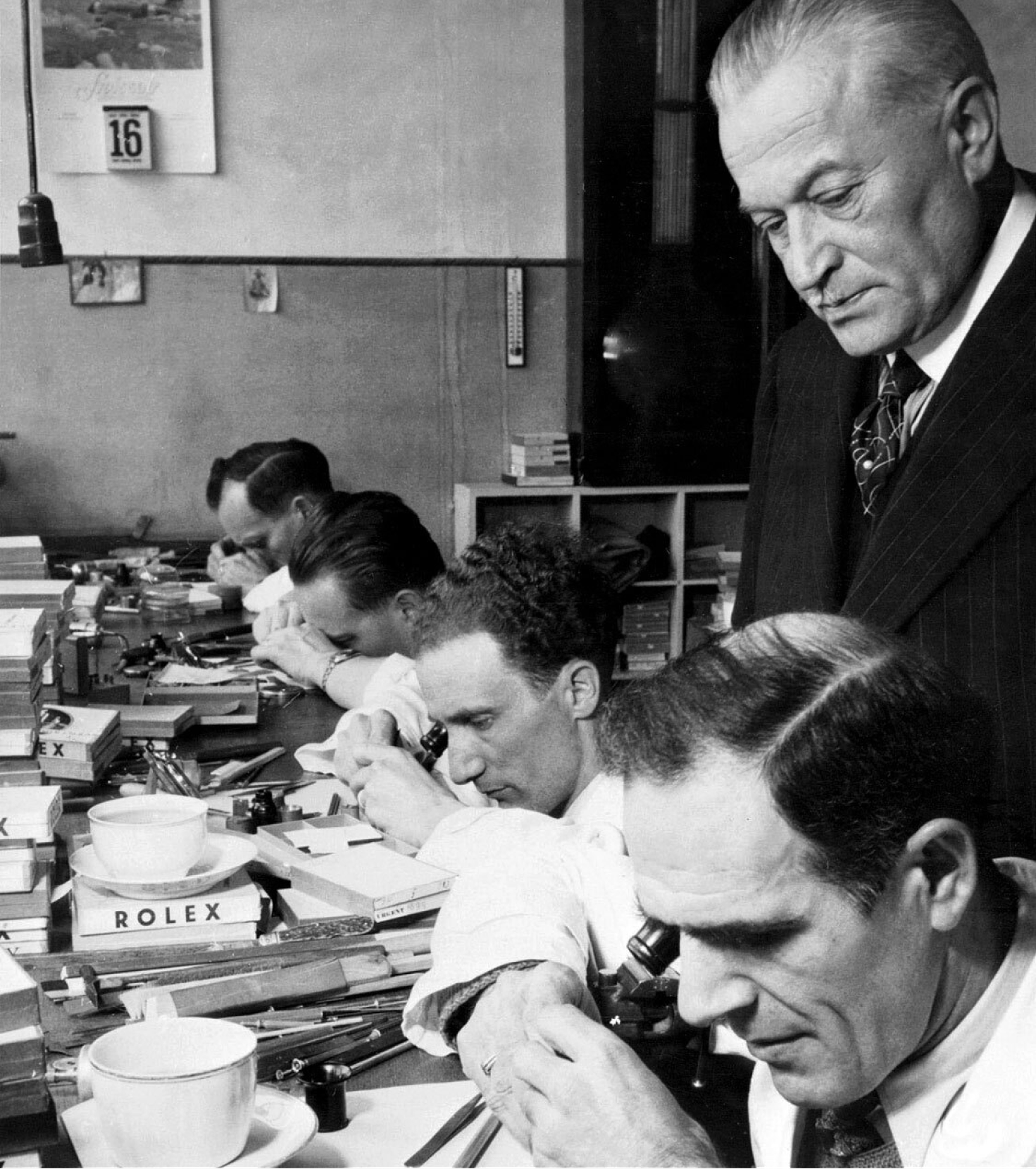 Hans Wilsdorf overseeing the production line of Rolex Watches.