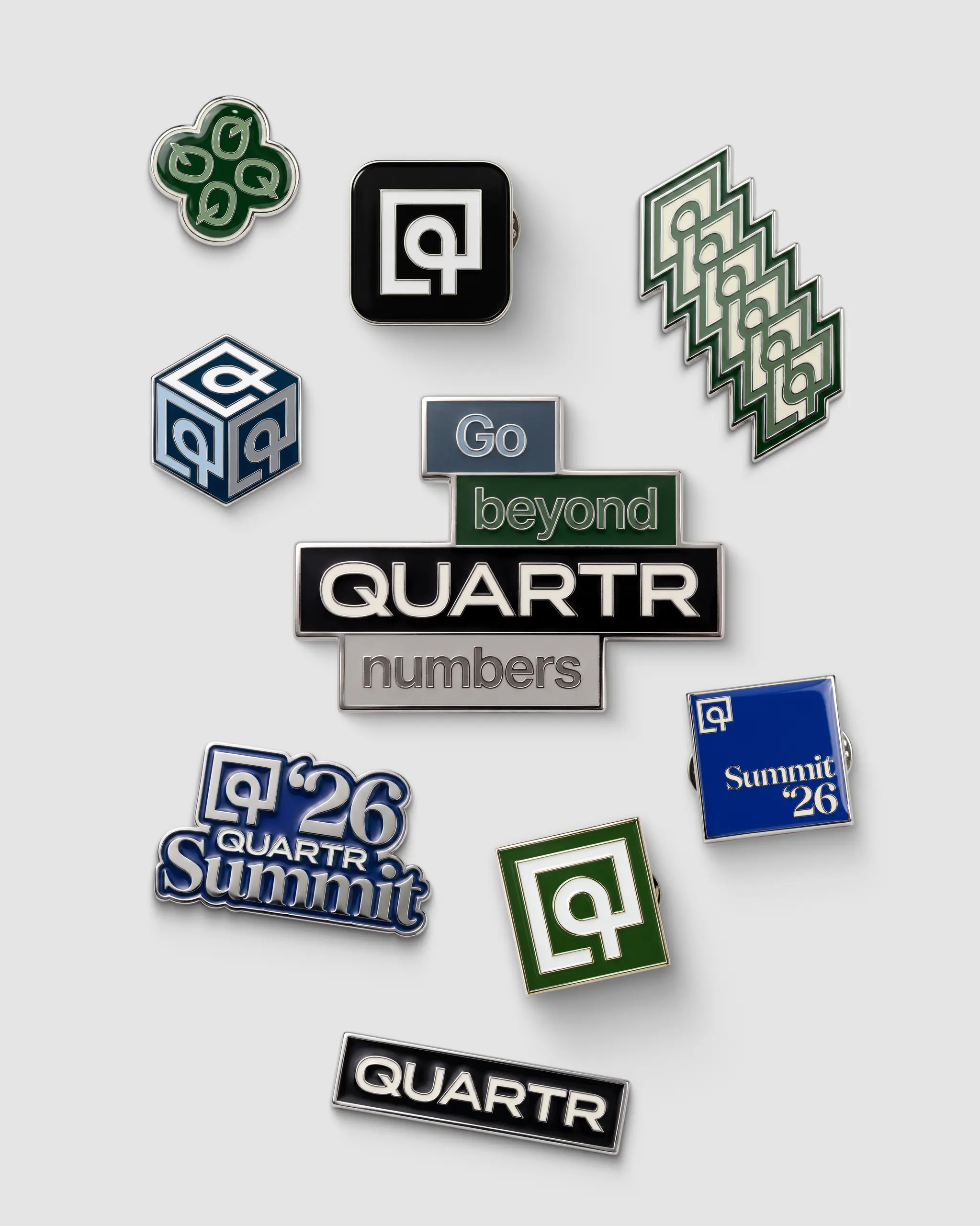 Quartr enamel pins