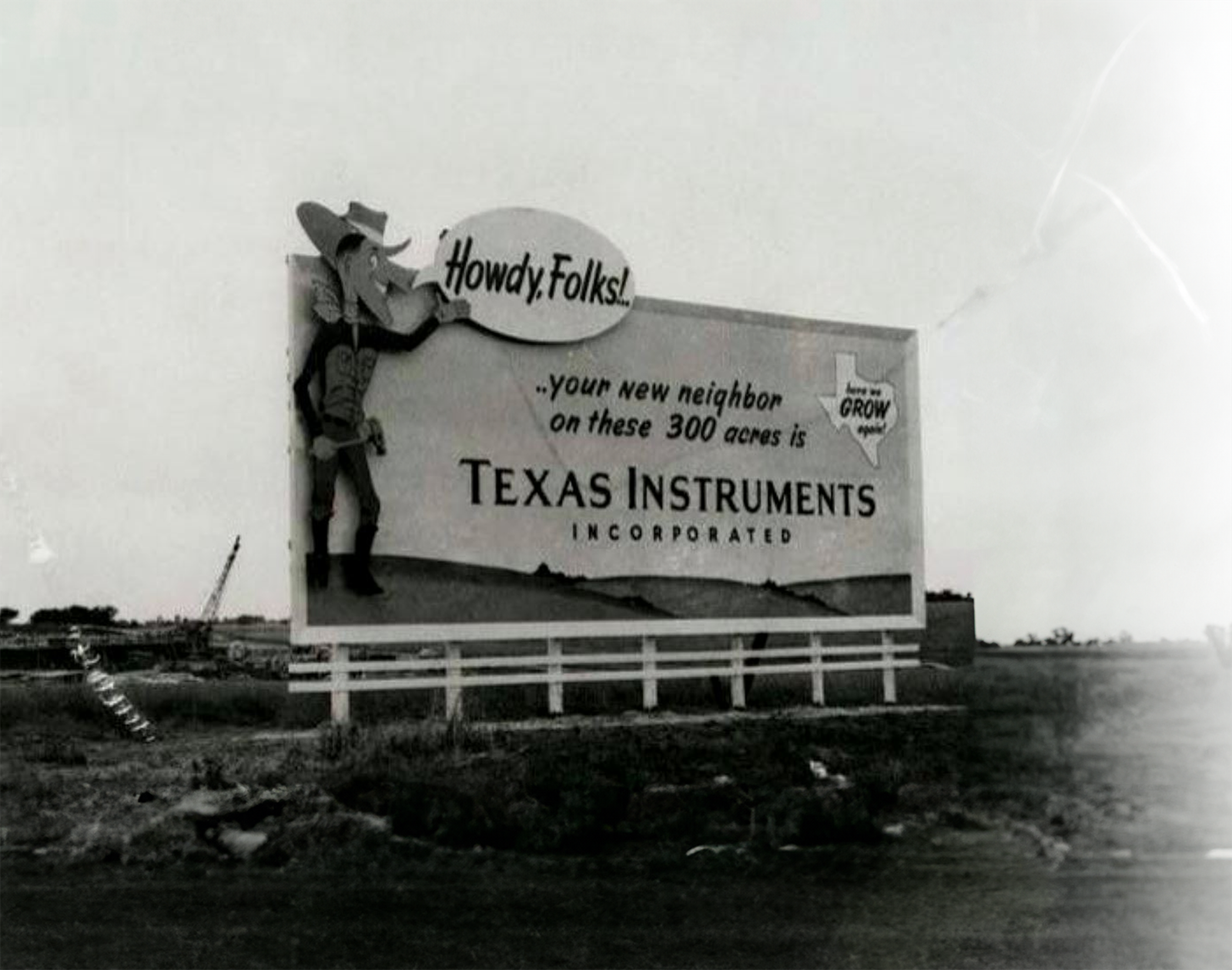 A Texas Instruments sign on the Dallas Expressway, 1957.