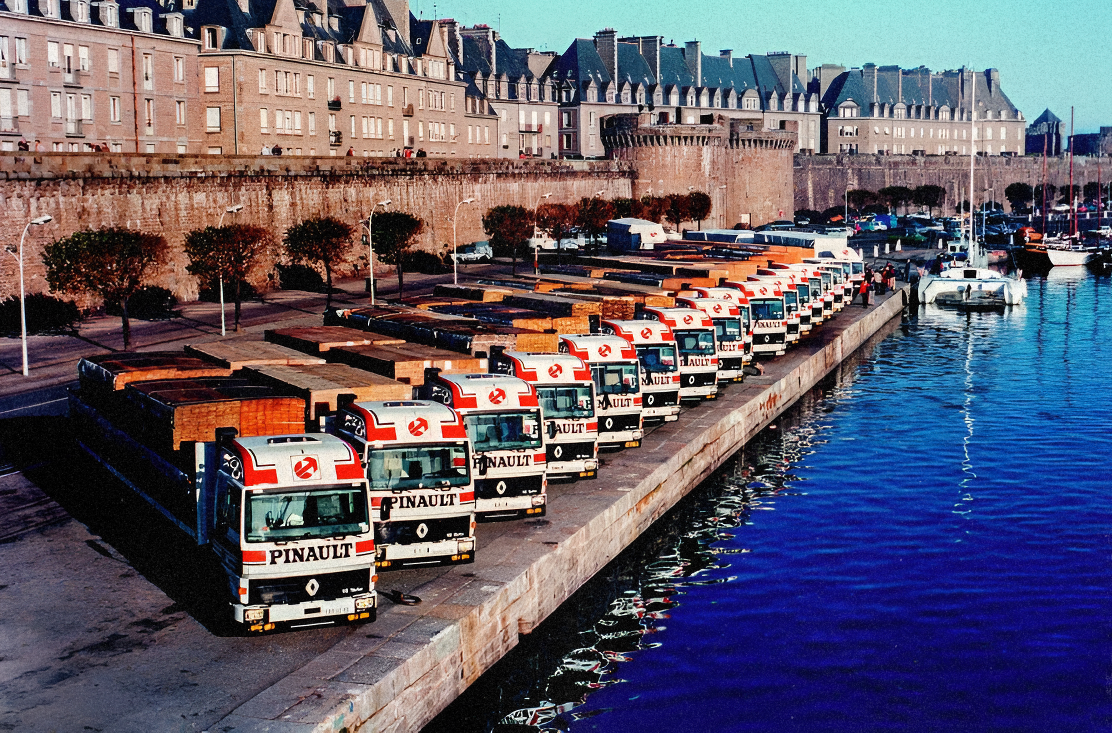 A fleet of Pinault's timber transport trucks