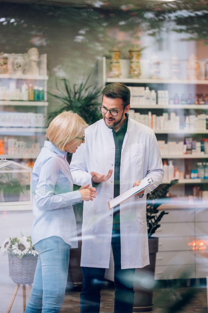 Pharmacist talking with patient