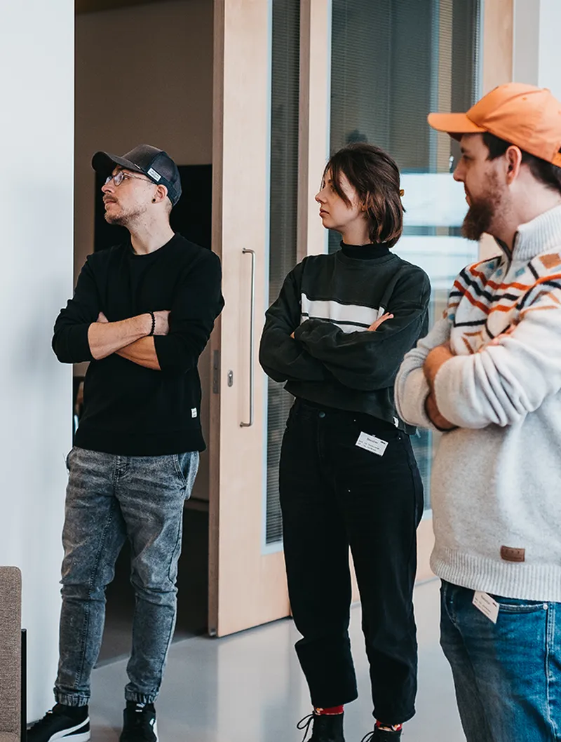 the team of dorfjungs standing in a row and watching something in the vitra campus