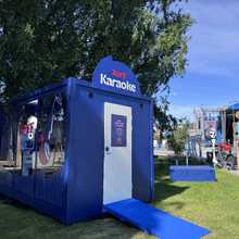 A karaoke stage at an outdoor pop-up event