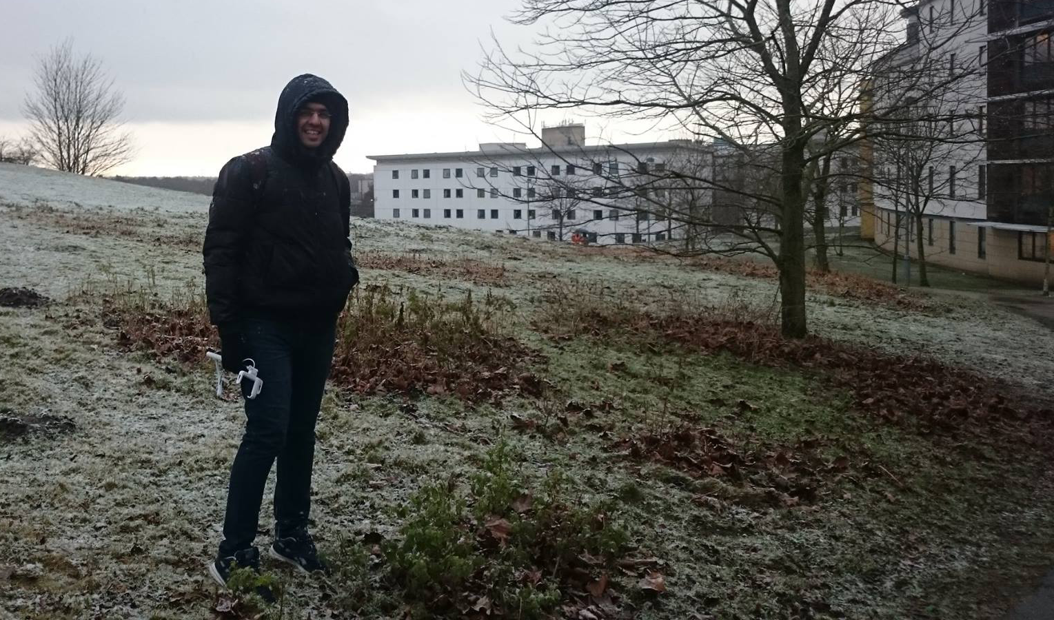 Picture of Moustafa Kamal standing in the frost outside UEA accommodation block